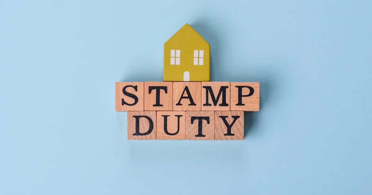 stamp duty word block with yellow house