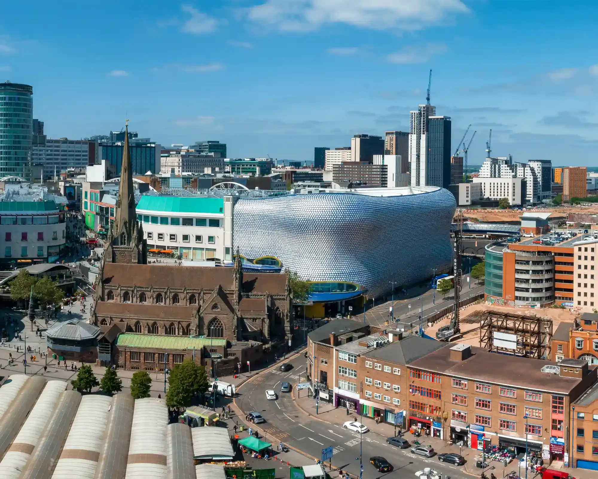Aerial view of Birmingham city centre skyline, featuring the Bullring and St Martin's Church, home to our conveyancing solicitors