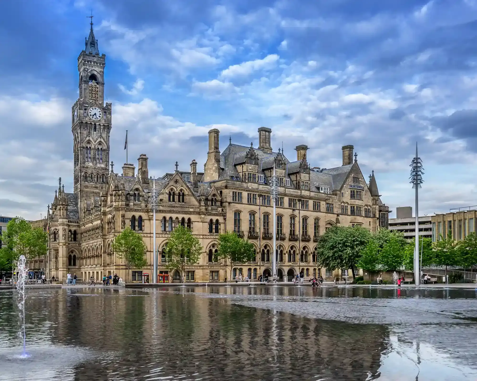 Bradford City Hall reflected in the Centenary Square mirror pool, home to our conveyancing solicitors