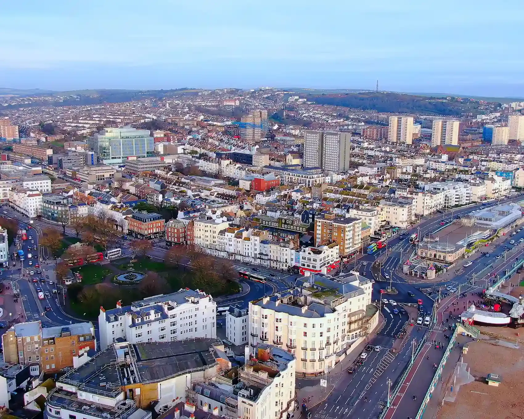 Aerial view of Brighton city and seafront, featuring the seaside promenade and city rooftops