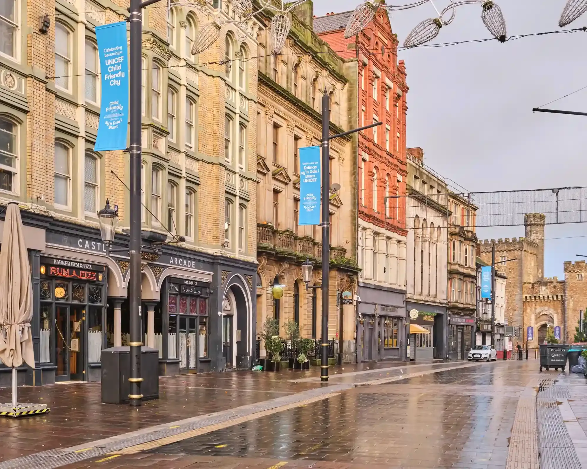 Castle Street in Cardiff city centre, with Cardiff Castle in the background, home to our conveyancing solicitors