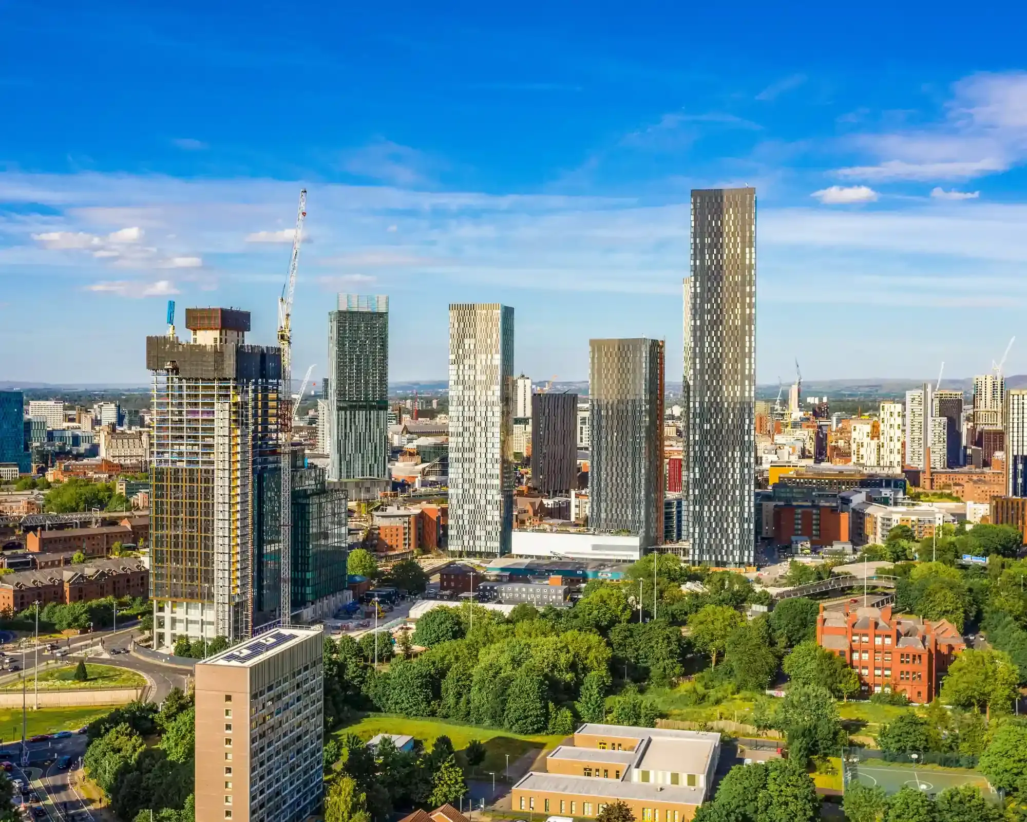 Aerial view of Manchester city centre, featuring the Deansgate Square skyscrapers