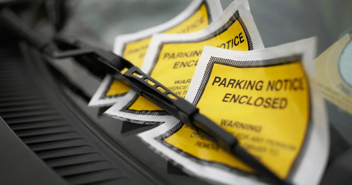 Parking notice displayed in a van window