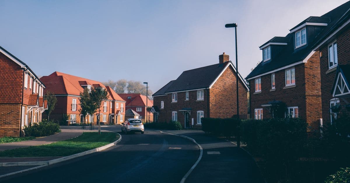 Serene morning view of an English suburban street lined with charming red-brick houses in Farnham.
