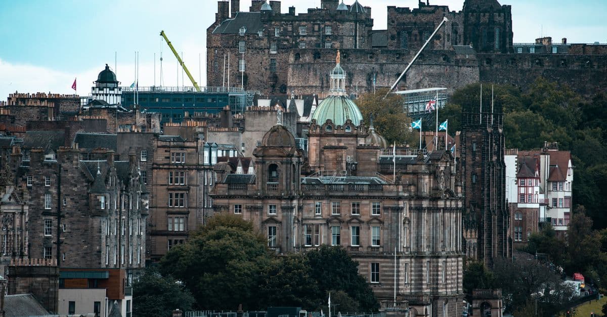 Breathtaking view of Edinburgh cityscape with Edinburgh Castle in the background.