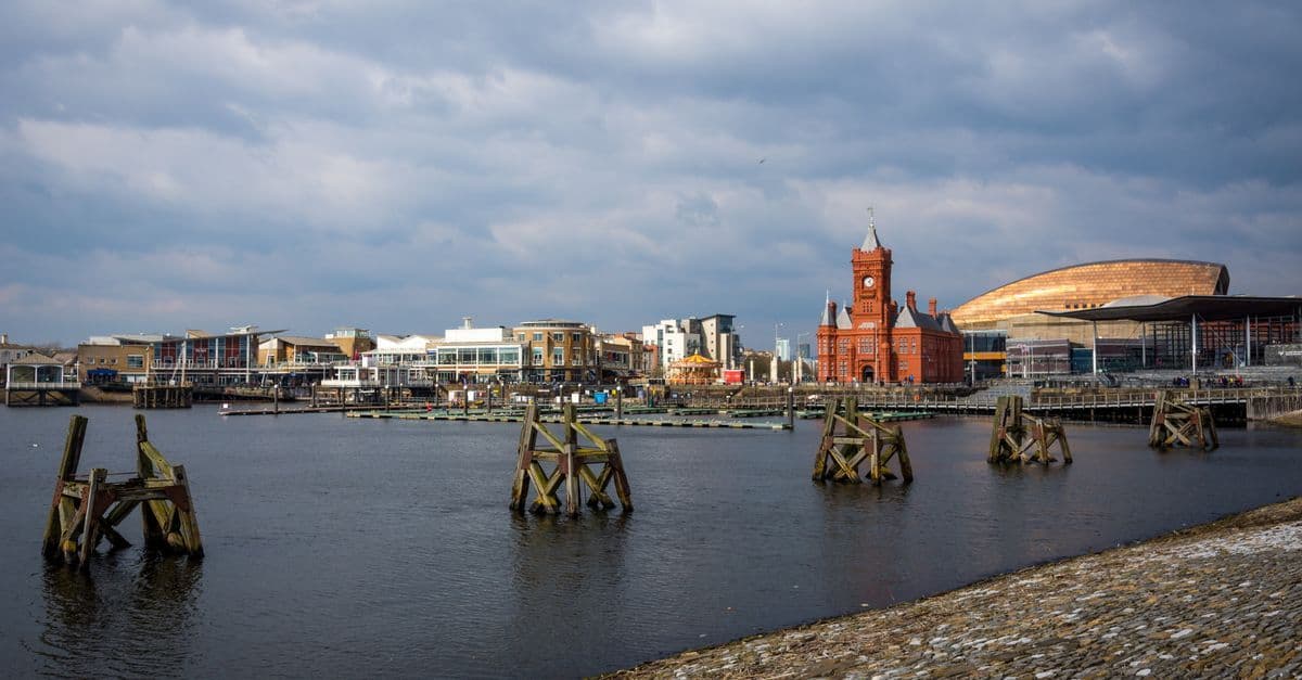 Scenic view of Cardiff Bay, featuring the Pierhead Building and waterfront.