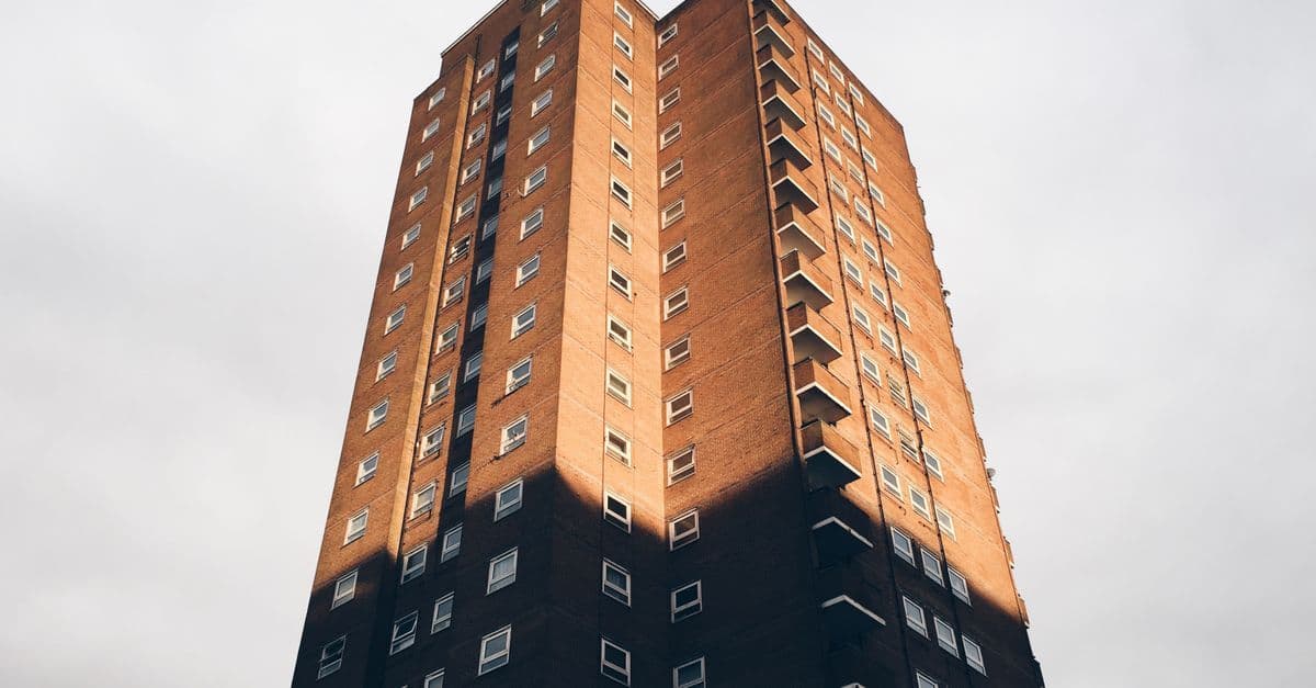 A tall residential apartment building with a classic facade in Brighton, England.