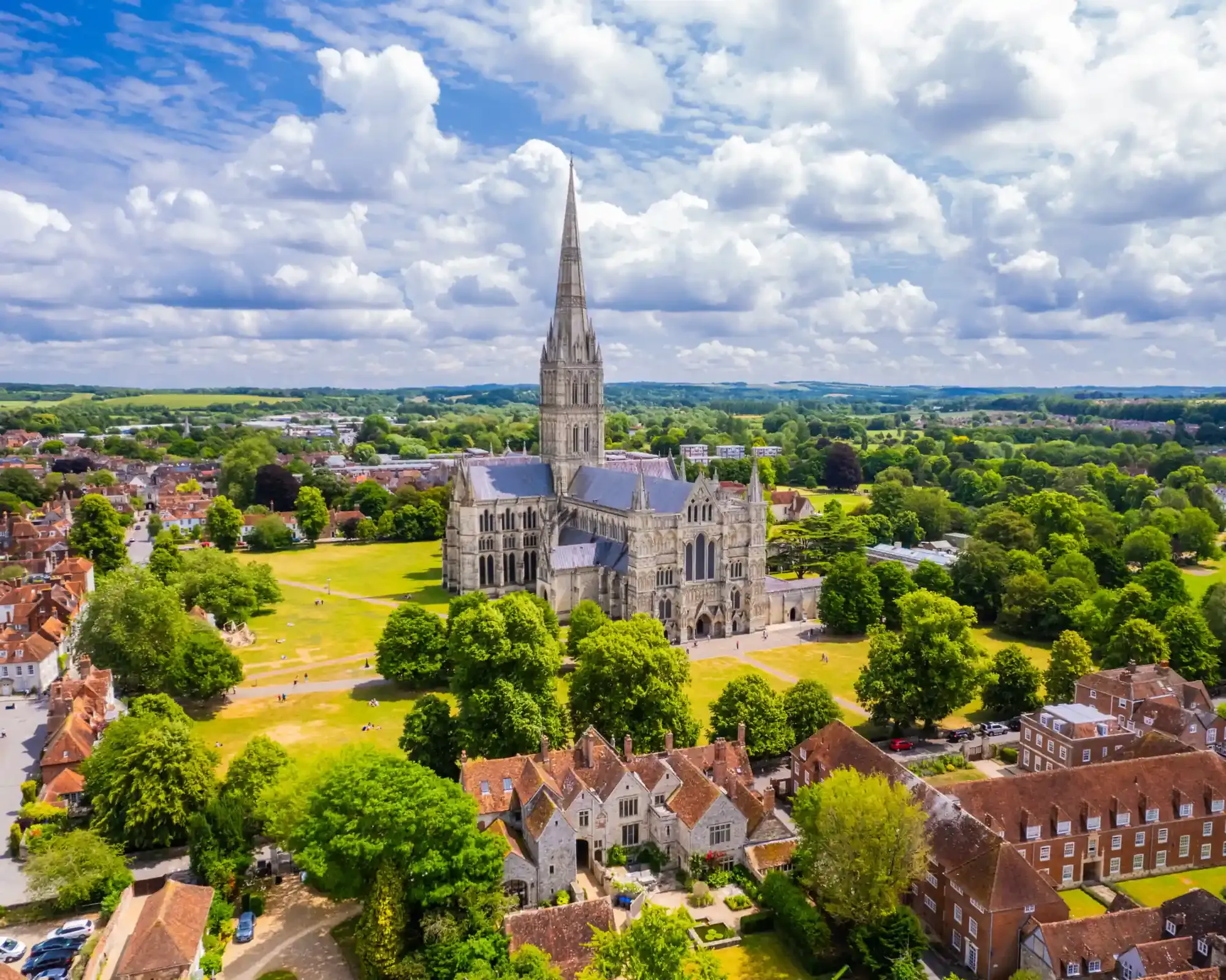 Aerial view of Salisbury Cathedral and its spire rising above the Cathedral Close.