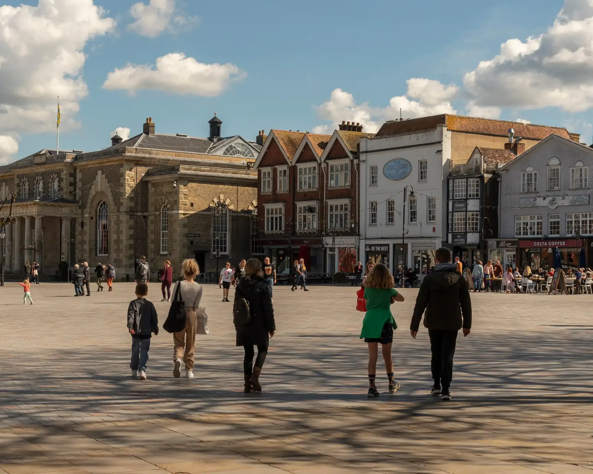 Salisbury’s Market Place with the Guildhall and historic shopfronts on a sunny day.